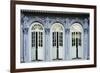 Traditional shophouse windows open out onto a street in the Orchard Road neighborhood in Singapore-Logan Brown-Framed Photographic Print