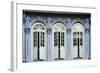 Traditional shophouse windows open out onto a street in the Orchard Road neighborhood in Singapore-Logan Brown-Framed Photographic Print