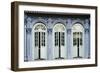 Traditional shophouse windows open out onto a street in the Orchard Road neighborhood in Singapore-Logan Brown-Framed Photographic Print