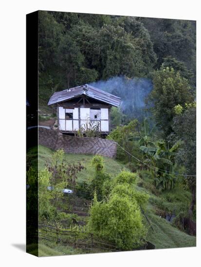 Traditional Small Bhutanese House with Smoke Coming from Roof from Open Fire Inside, Near Trongsa, -Lee Frost-Stretched Canvas