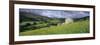 Traditional stone barn and buttercup meadow in Swaledale with stormy sky-Stuart Black-Framed Photographic Print