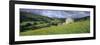 Traditional stone barn and buttercup meadow in Swaledale with stormy sky-Stuart Black-Framed Photographic Print