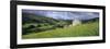 Traditional stone barn and buttercup meadow in Swaledale with stormy sky-Stuart Black-Framed Photographic Print