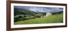 Traditional stone barn and buttercup meadow in Swaledale with stormy sky-Stuart Black-Framed Photographic Print