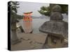 Traditional Stone Candle Stands with Floating Torii Beyond, Itsuku Shima Jinja, Honshu, Japan-Simanor Eitan-Stretched Canvas