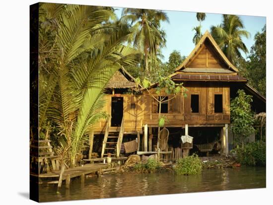 Traditional Thai House on Stilts Above the River in Bangkok, Thailand, Southeast Asia-Sassoon Sybil-Stretched Canvas