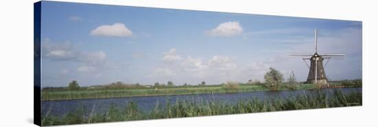 Traditional Windmill in the Village, Netherlands-null-Stretched Canvas