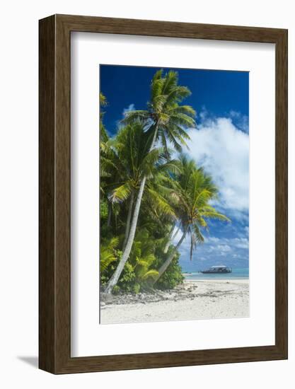 Traditional wood carved boat in the Aitutaki lagoon, Rarotonga and the Cook Islands, South Pacific,-Michael Runkel-Framed Photographic Print