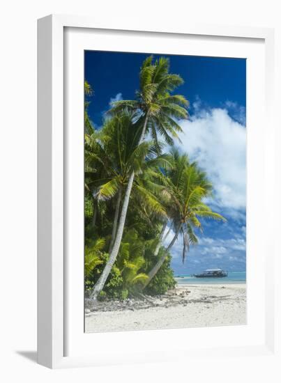 Traditional wood carved boat in the Aitutaki lagoon, Rarotonga and the Cook Islands, South Pacific,-Michael Runkel-Framed Photographic Print