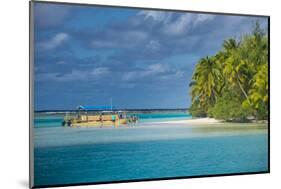 Traditional wood carved boat in the Aitutaki lagoon, Rarotonga and the Cook Islands, South Pacific,-Michael Runkel-Mounted Photographic Print