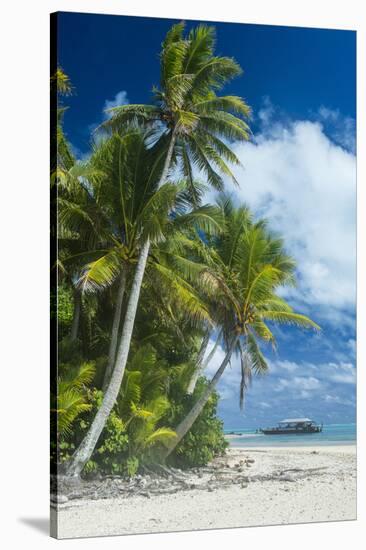 Traditional wood carved boat in the Aitutaki lagoon, Rarotonga and the Cook Islands, South Pacific,-Michael Runkel-Stretched Canvas