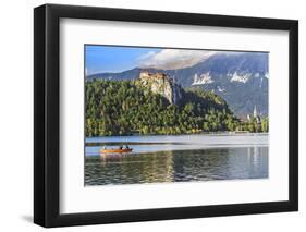 Traditional wooden pletnja rowing boat to ferry tourists to St. Mary's Church of Assumption on the-Miva Stock-Framed Photographic Print