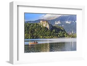 Traditional wooden pletnja rowing boat to ferry tourists to St. Mary's Church of Assumption on the-Miva Stock-Framed Photographic Print