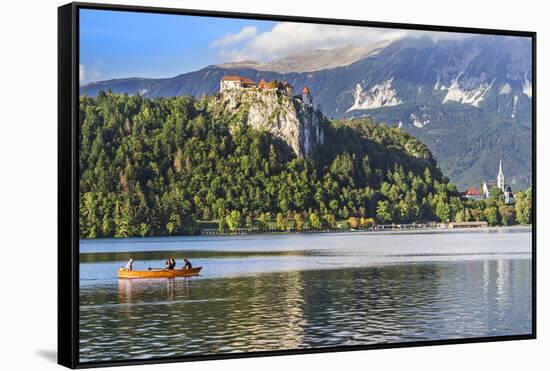 Traditional wooden pletnja rowing boat to ferry tourists to St. Mary's Church of Assumption on the-Miva Stock-Framed Stretched Canvas