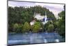 Traditional wooden pletnja rowing boat used to ferry tourists to St. Mary's Church of Assumption on-Miva Stock-Mounted Photographic Print