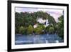 Traditional wooden pletnja rowing boat used to ferry tourists to St. Mary's Church of Assumption on-Miva Stock-Framed Photographic Print