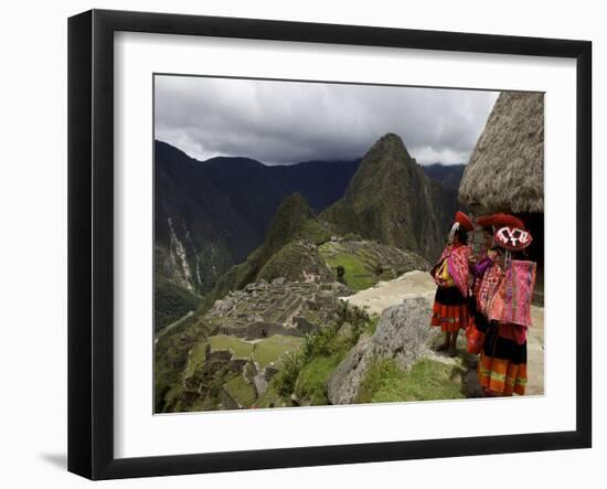 Traditionally Dressed Children Looking over the Ruins of Machu Picchu, UNESCO World Heritage Site, -Simon Montgomery-Framed Photographic Print