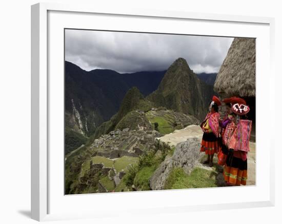 Traditionally Dressed Children Looking over the Ruins of Machu Picchu, UNESCO World Heritage Site, -Simon Montgomery-Framed Photographic Print