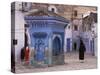 Traditionally Dressed Muslims in the Plaza Alhaouta, Morocco-Merrill Images-Stretched Canvas