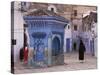 Traditionally Dressed Muslims in the Plaza Alhaouta, Morocco-Merrill Images-Stretched Canvas