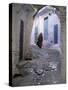 Traditionally Dressed Woman along Cobblestone Alley, Morocco-Merrill Images-Stretched Canvas
