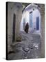 Traditionally Dressed Woman along Cobblestone Alley, Morocco-Merrill Images-Stretched Canvas
