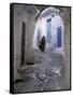 Traditionally Dressed Woman along Cobblestone Alley, Morocco-Merrill Images-Framed Stretched Canvas