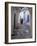 Traditionally Dressed Woman along Cobblestone Alley, Morocco-Merrill Images-Framed Photographic Print