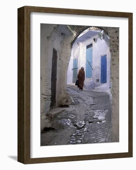 Traditionally Dressed Woman along Cobblestone Alley, Morocco-Merrill Images-Framed Photographic Print