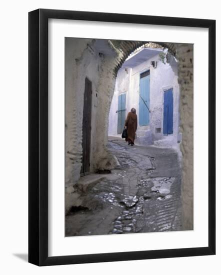 Traditionally Dressed Woman along Cobblestone Alley, Morocco-Merrill Images-Framed Photographic Print