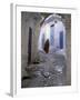 Traditionally Dressed Woman along Cobblestone Alley, Morocco-Merrill Images-Framed Photographic Print