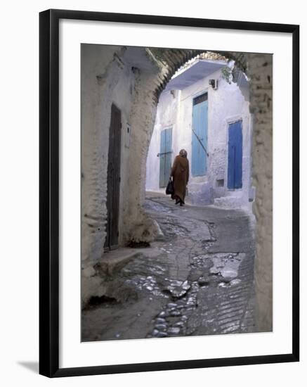 Traditionally Dressed Woman along Cobblestone Alley, Morocco-Merrill Images-Framed Photographic Print