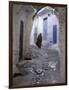 Traditionally Dressed Woman along Cobblestone Alley, Morocco-Merrill Images-Framed Photographic Print
