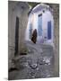 Traditionally Dressed Woman along Cobblestone Alley, Morocco-Merrill Images-Mounted Photographic Print