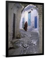 Traditionally Dressed Woman along Cobblestone Alley, Morocco-Merrill Images-Framed Photographic Print