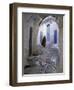 Traditionally Dressed Woman along Cobblestone Alley, Morocco-Merrill Images-Framed Photographic Print