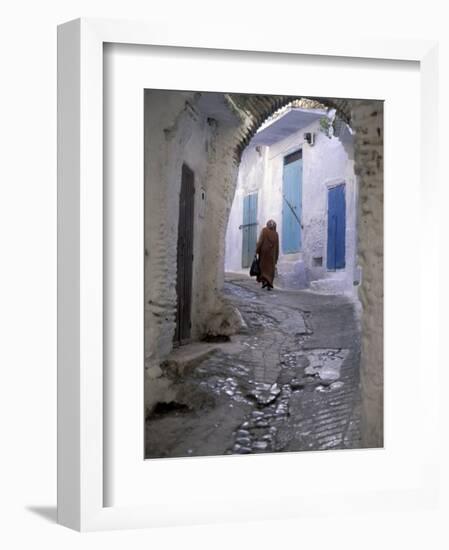 Traditionally Dressed Woman along Cobblestone Alley, Morocco-Merrill Images-Framed Photographic Print