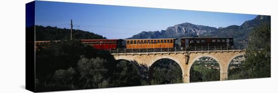 Train Crossing a Bridge, Sierra de Tramuntana, Majorca, Spain-null-Stretched Canvas