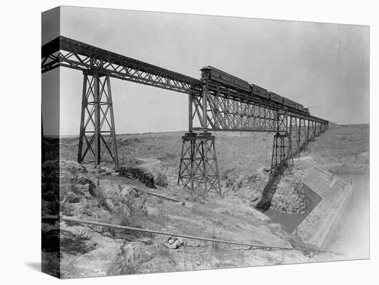 Train Crossing Bridge over Dam-William Henry Jackson-Stretched Canvas