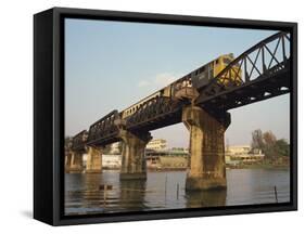 Train Crossing the River Kwai Bridge at Kanchanburi in Thailand, Southeast Asia-Charcrit Boonsom-Framed Stretched Canvas