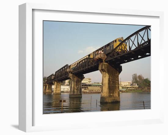 Train Crossing the River Kwai Bridge at Kanchanburi in Thailand, Southeast Asia-Charcrit Boonsom-Framed Photographic Print