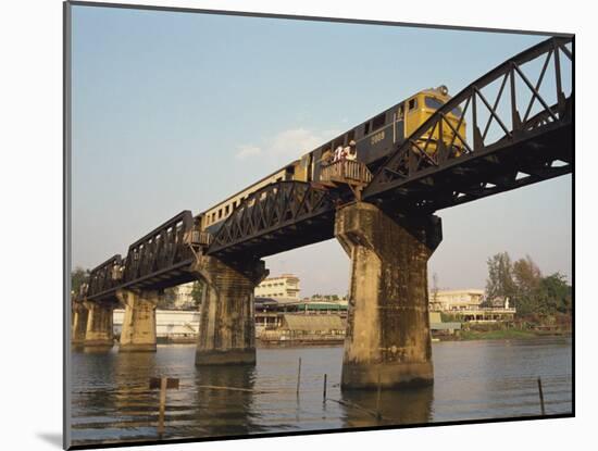 Train Crossing the River Kwai Bridge at Kanchanburi in Thailand, Southeast Asia-Charcrit Boonsom-Mounted Photographic Print