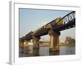 Train Crossing the River Kwai Bridge at Kanchanburi in Thailand, Southeast Asia-Charcrit Boonsom-Framed Photographic Print