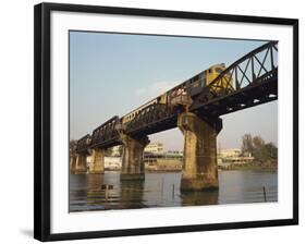 Train Crossing the River Kwai Bridge at Kanchanburi in Thailand, Southeast Asia-Charcrit Boonsom-Framed Photographic Print