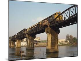 Train Crossing the River Kwai Bridge at Kanchanburi in Thailand, Southeast Asia-Charcrit Boonsom-Mounted Photographic Print