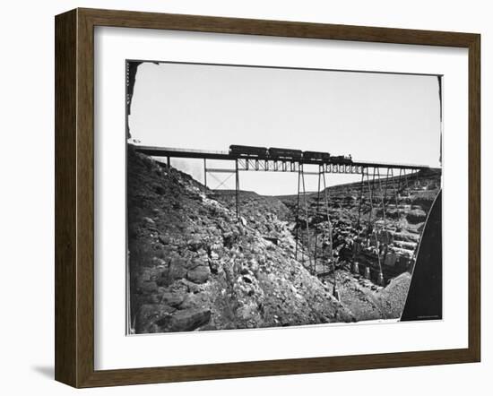 Train Traveling over Santa Fe Railroad Bridge, Which is Built over Canyon Diablo-null-Framed Photographic Print