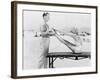 Trainer and Young Woman Doing Exercises at the Beach-null-Framed Photo