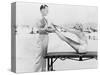 Trainer and Young Woman Doing Exercises at the Beach-null-Stretched Canvas