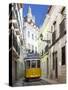 Tram (Electricos) Along Rua Das Escolas Gerais with Tower of Sao Vicente de Fora, Lisbon, Portugal-Stuart Black-Stretched Canvas