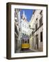 Tram (Electricos) Along Rua Das Escolas Gerais with Tower of Sao Vicente de Fora, Lisbon, Portugal-Stuart Black-Framed Photographic Print